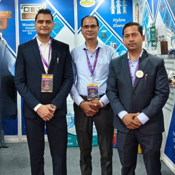 Petro Industech team standing at trade exhibition stall promoting CPP business partnership program