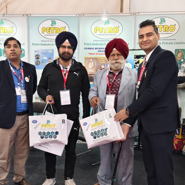 Nitesh Khurana with Petro team interacting with visitors at trade exhibition showcasing bathroom accessories products
