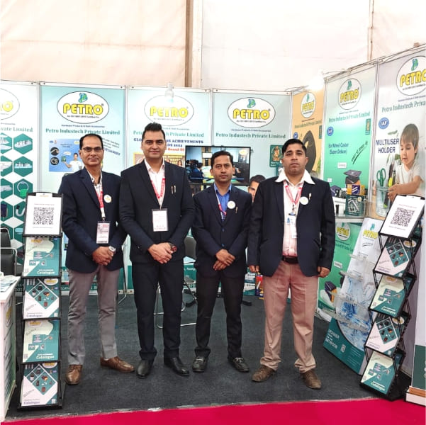 Petro Industech team standing at exhibition booth showcasing bathroom accessories and hardware products