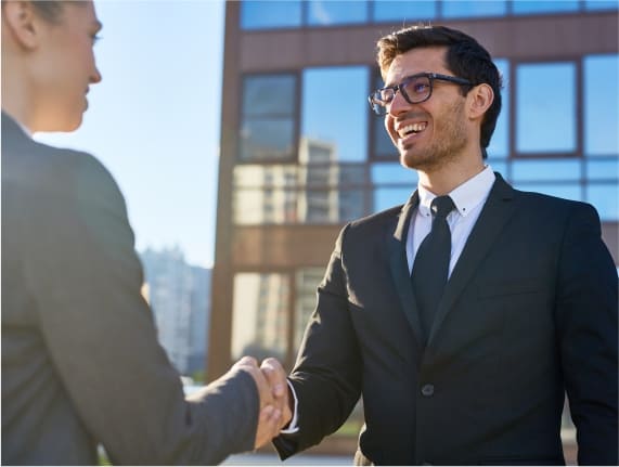 Professional business handshake representing trusted partnership